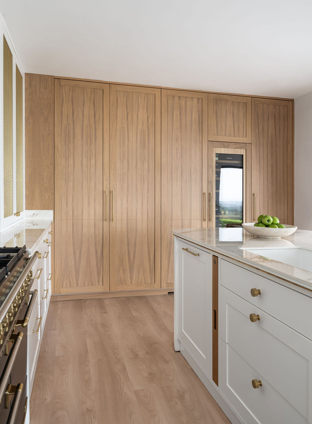 Custom made to measure modern classic kitchen with large island, quartz worktop, s-box power point, luxurious details and pendant lights