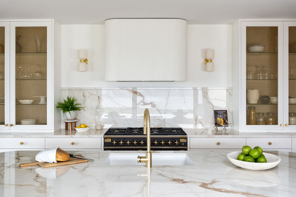 Custom made to measure modern classic kitchen with large island, quartz worktop, s-box power point, luxurious details and pendant lights