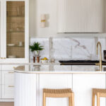 Custom made to measure modern classic kitchen with large island, quartz worktop, s-box power point, luxurious details and pendant lights