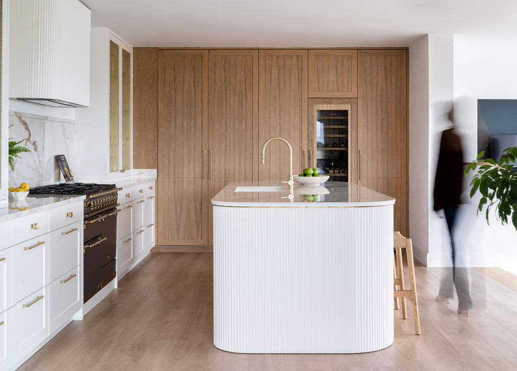 Custom made to measure modern classic kitchen with large island, quartz worktop, s-box power point, luxurious details and pendant lights